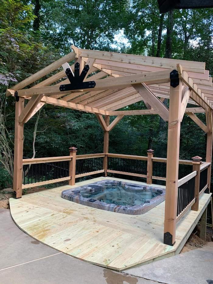 Timber pavilion over a hot tub