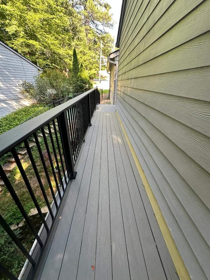 Long composite walkway deck with black railing
